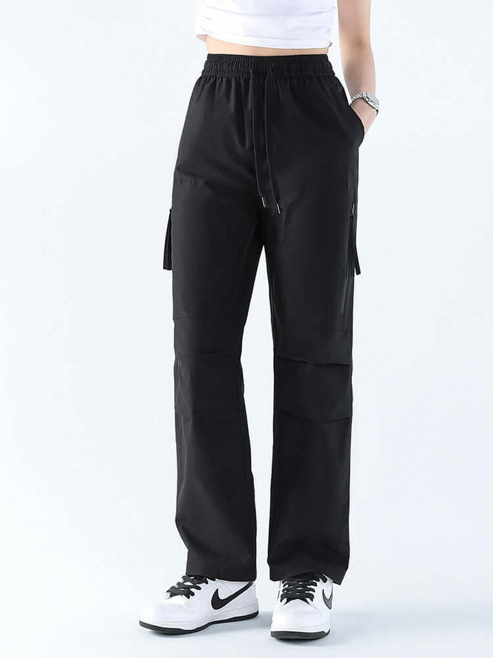 Versatile women's waterproof hiking pants, loose fit straight leg for comfortable outdoor and travel wear.