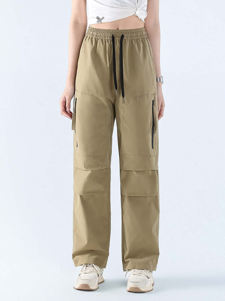 All-weather women's waterproof pants, loose straight design for outdoor protection & comfort.