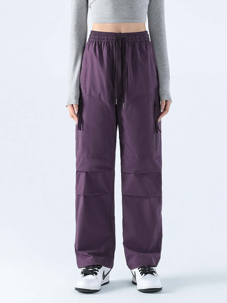 Durable women's waterproof loose straight pants. All-weather comfort for hiking, travel, & casual outdoors.