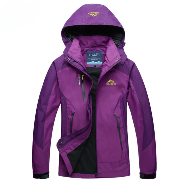 Lightweight women's waterproof quilted jacket with hood. Comfortable activewear, perfect for hiking and travel in any weather.