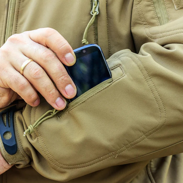 Detail of women's hooded waterproof tactical jacket, offering ultimate weather protection.
