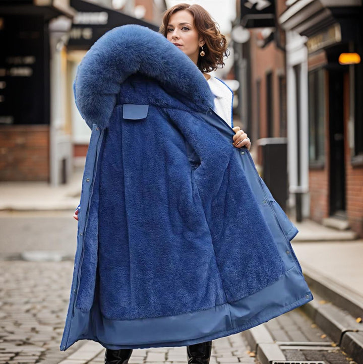 Functional women's waterproof winter coat, warm and insulated for all-season cold weather protection. Stylish long outerwear.