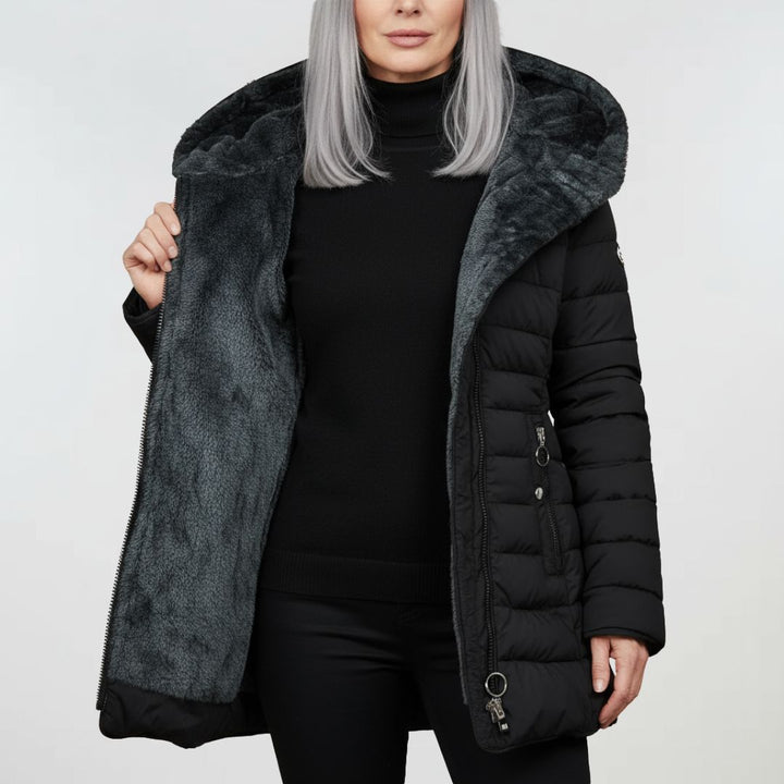 Texture of the women's waterproof winter coat fabric, highlighting its durable & weather-resistant outerwear material.