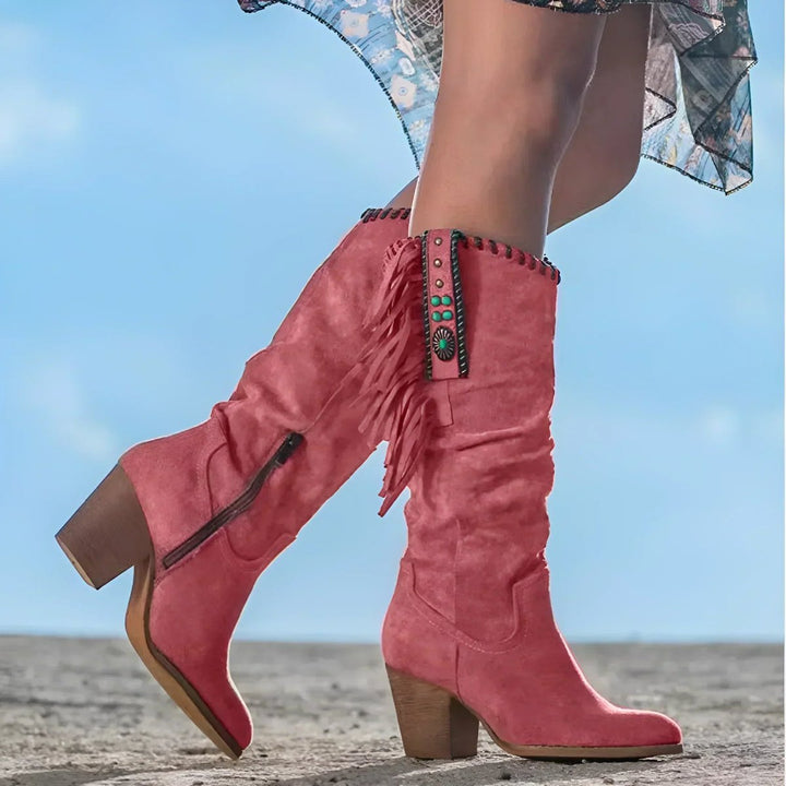 Boho-chic fringe cowboy boots for women, knee-high with a comfortable block heel, perfect for country & festival looks.