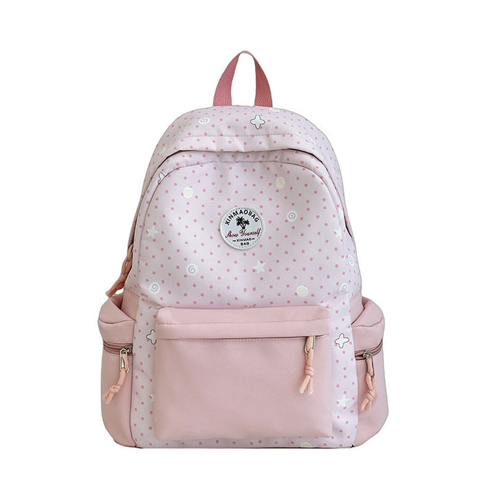 Chic women's whimsical patterned backpack featuring vibrant colors & adjustable straps, a versatile fashion daily bag.