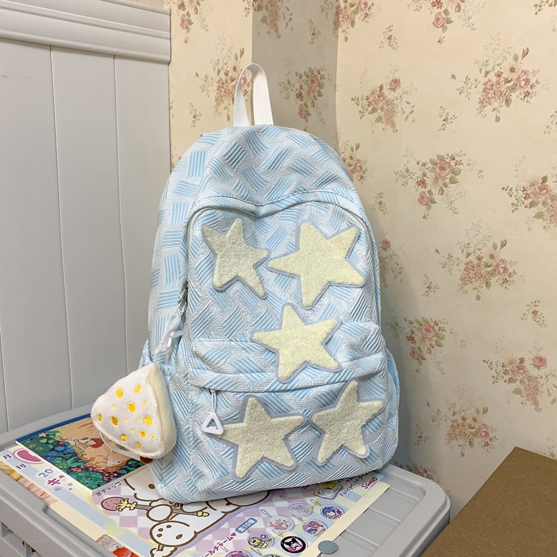 Women's whimsical star-embroidered backpack, a cute and colorful fashion accessory for school or travel.