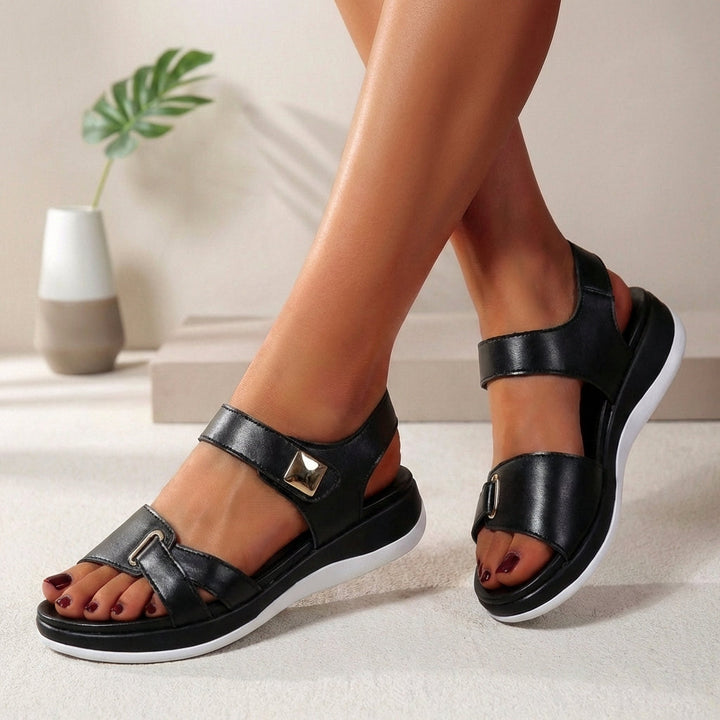 Black women's open-toe platform sandals with adjustable straps, offering ultimate summer comfort & style.