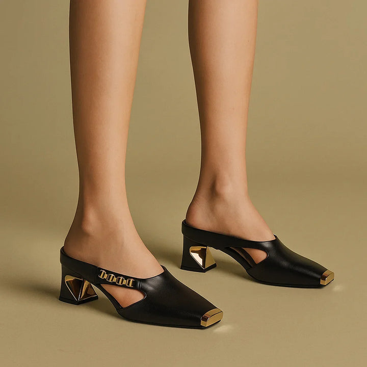 Women's white block-heel sandals with a unique square metallic toe and gold-tone chain. Trendy summer footwear.