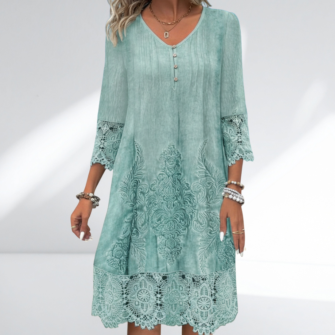 Women's white boho midi dress with intricate embroidery, delicate lace trim, and three-quarter sleeves for summer festivals.