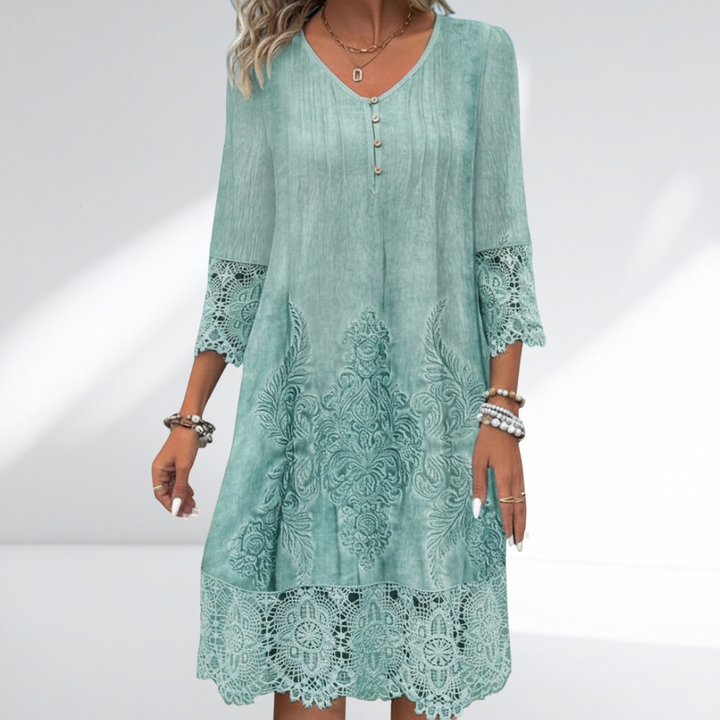 Women's white boho midi dress with intricate embroidery, delicate lace trim, and three-quarter sleeves for summer festivals.