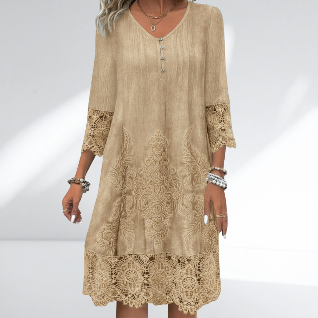 Stylish women's embroidered midi dress with delicate lace trim, flowy bohemian style, ideal for casual summer wear.
