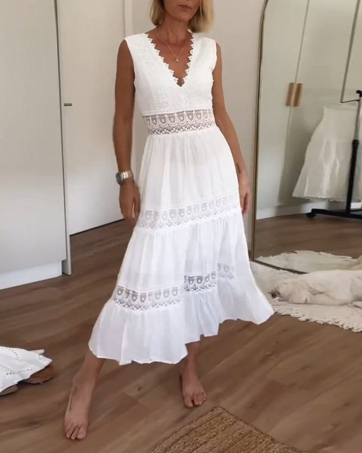 Women's white boho V-neck midi dress, perfect for summer vacation. Elegant sleeveless bohemian style.