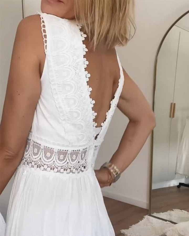Elegant white boho V-neck midi dress for women. Sleeveless summer dress with a relaxed, vacation-ready feel.