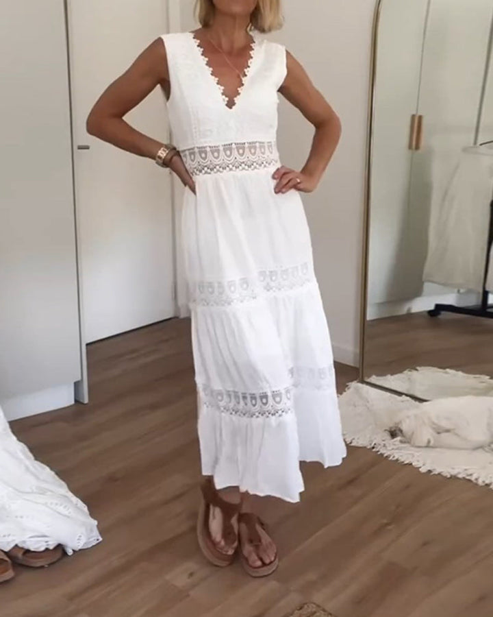 Stylish women's boho V-neck midi dress. Sleeveless summer casual wear with a flowing bohemian silhouette.
