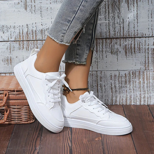 New women's white fashion sneakers. Lightweight and comfortable for daily wear, perfect for any casual look.