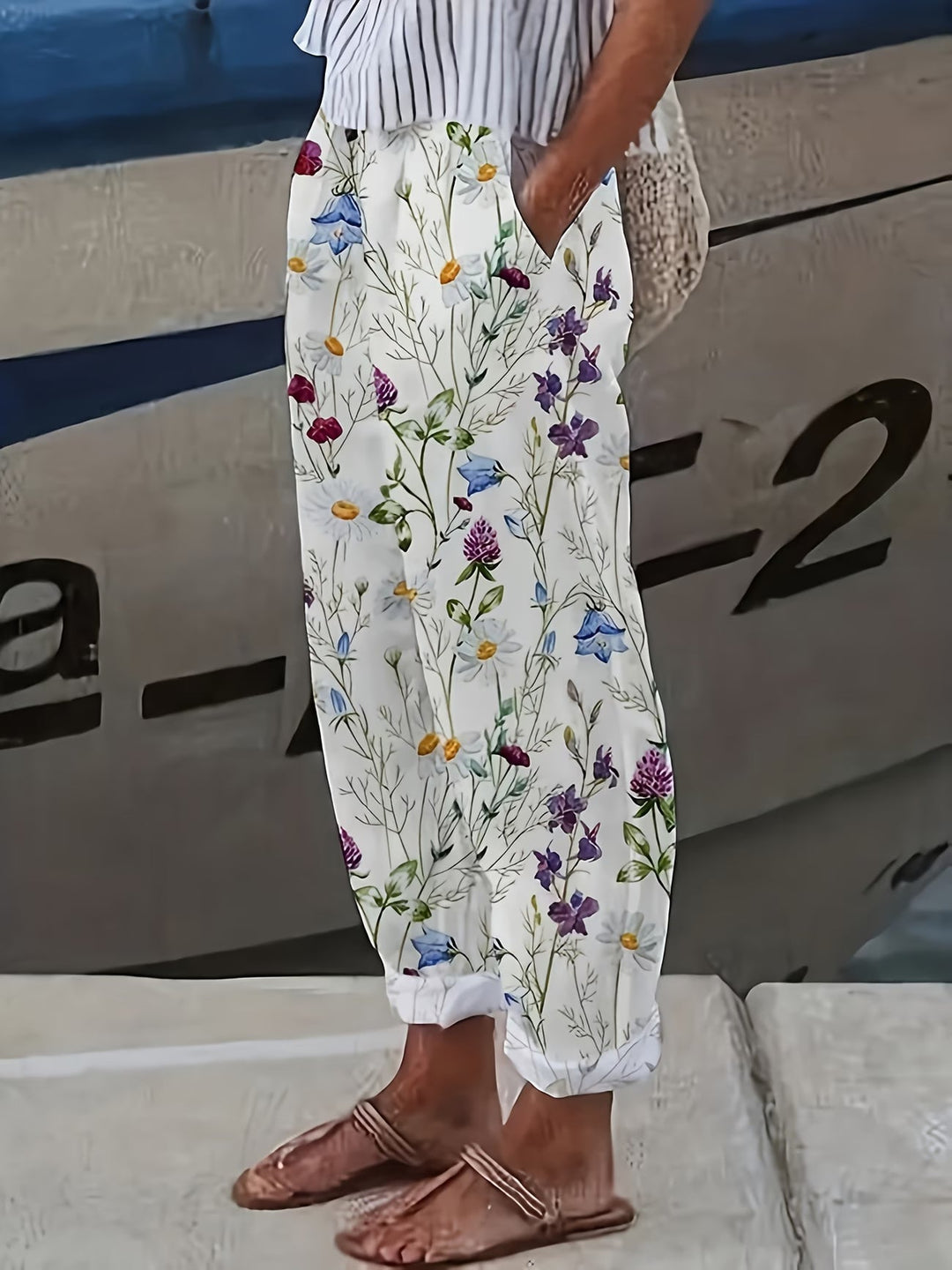 Women's white floral print summer pants, flowy & lightweight for warm weather style.