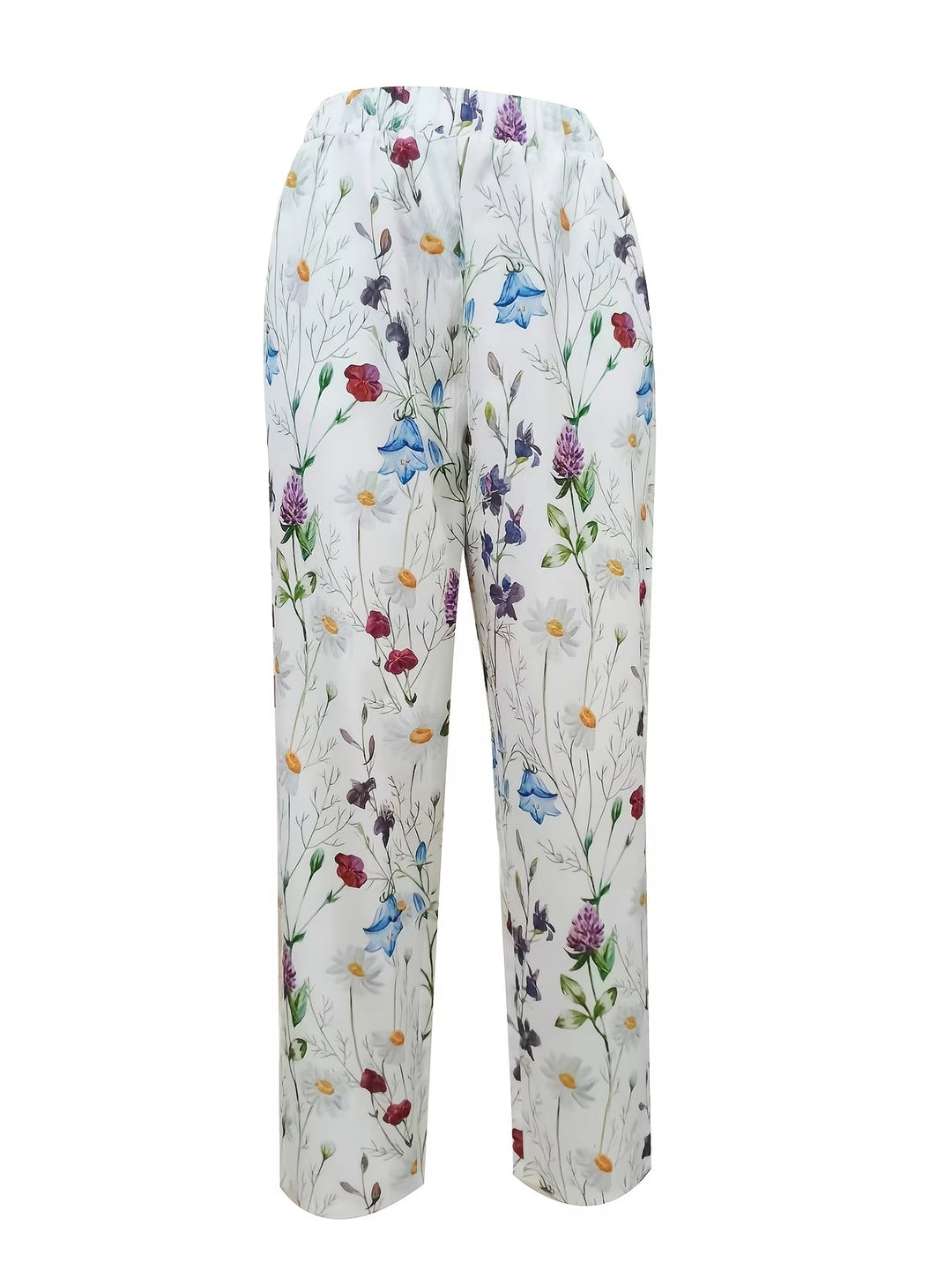 Elegant white floral trousers, lightweight and flowy, ideal for summer fashion & vacation outfits.