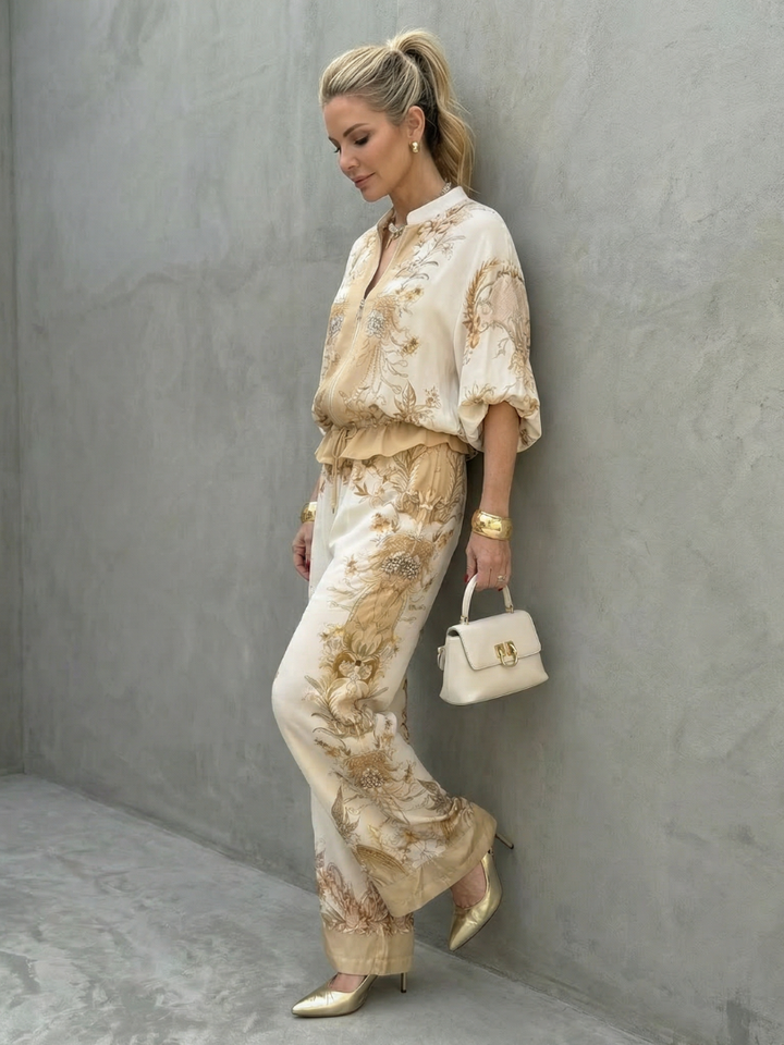 Model wearing a comfortable women's white floral relaxed fit two-piece set, perfect for spring/summer events.