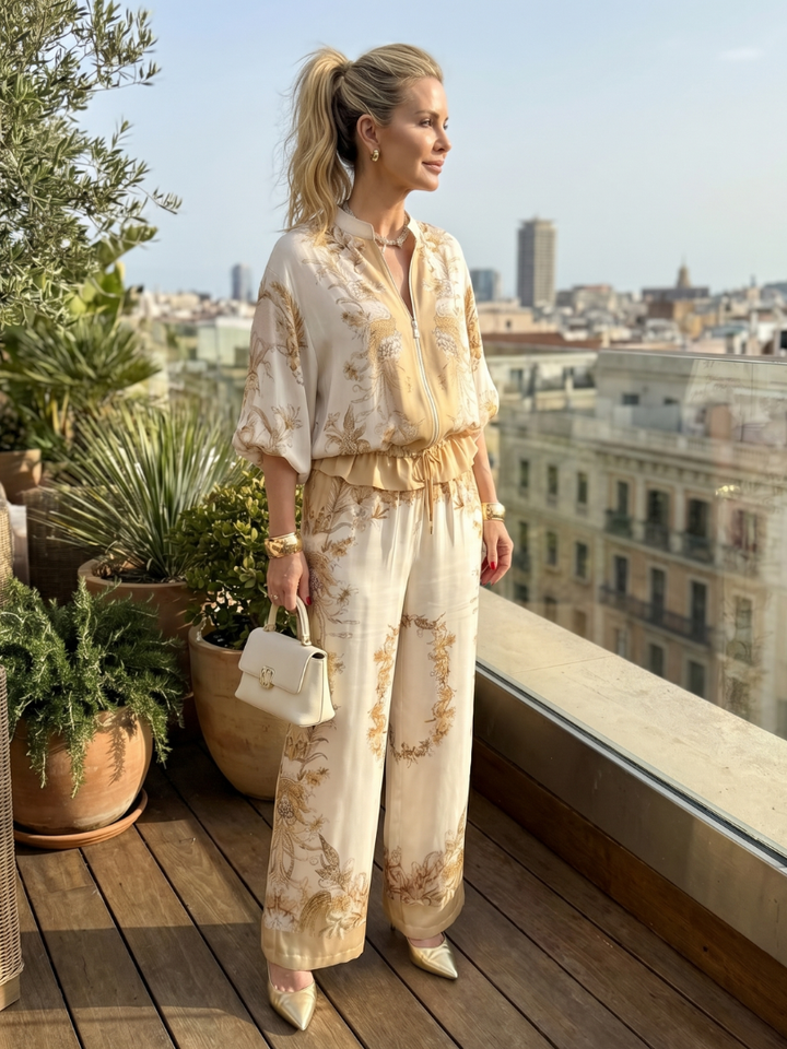 Comfortable women's floral print two-piece set, featuring a relaxed blouson top & flowy wide-leg trousers.