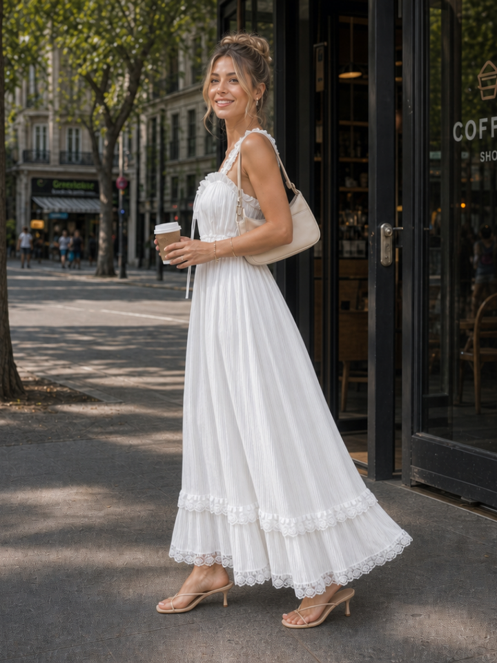 Flowing white women's midi dress with chic ruffle straps, a comfortable sleeveless design for summer & vacation fashion.