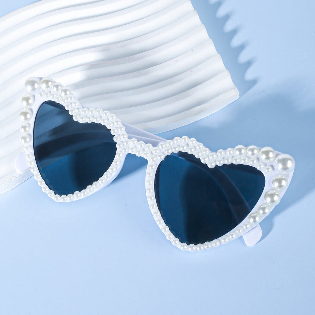 Women's white heart-shaped bridal sunglasses, perfect for 'Bride to Be' celebrations & bachelorette parties.