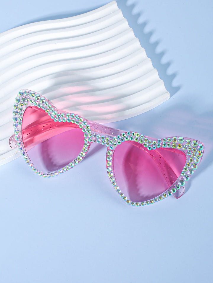 Unique heart-shaped 'Bride to Be' sunglasses, a standout accessory for the special day.