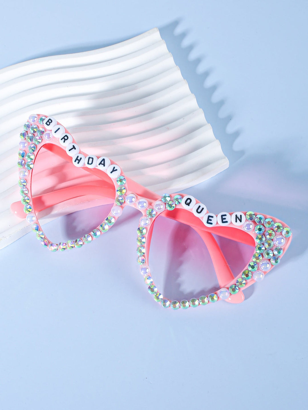 Glamorous pearl-embellished heart sunglasses for the bride-to-be, perfect for a bachelorette bash.