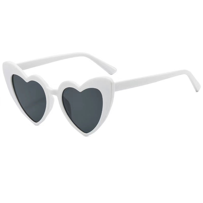 Fun bridal party heart sunglasses with white frames, a must-have accessory for any celebration.