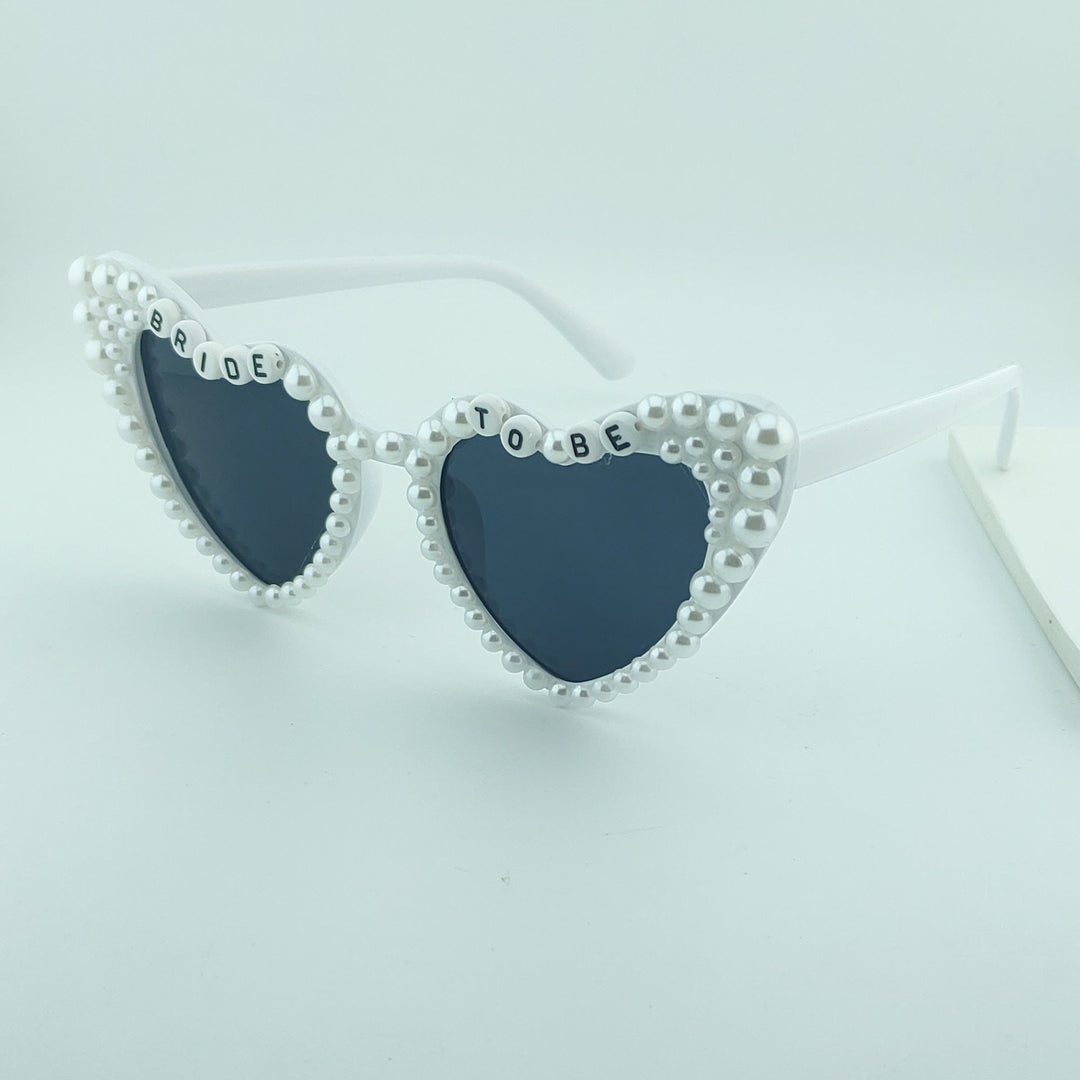 Celebratory heart sunglasses, a perfect wedding accessory or gift for the bride-to-be.