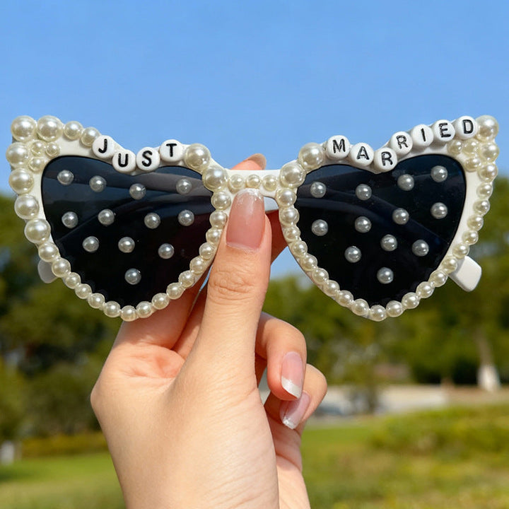 White heart sunglasses with pearls, a stunning accessory for a bride's special wedding day or party.