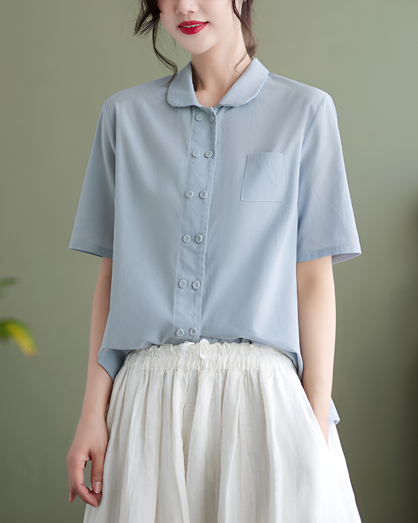 Women's white relaxed fit blouse, short sleeve, collared, button front. Ideal for summer casual style & elegant warm weather fashion.