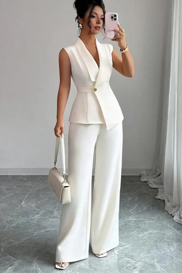 White women's tailored suit set: sleeveless blazer & wide leg trousers. Versatile for professional and formal wear.