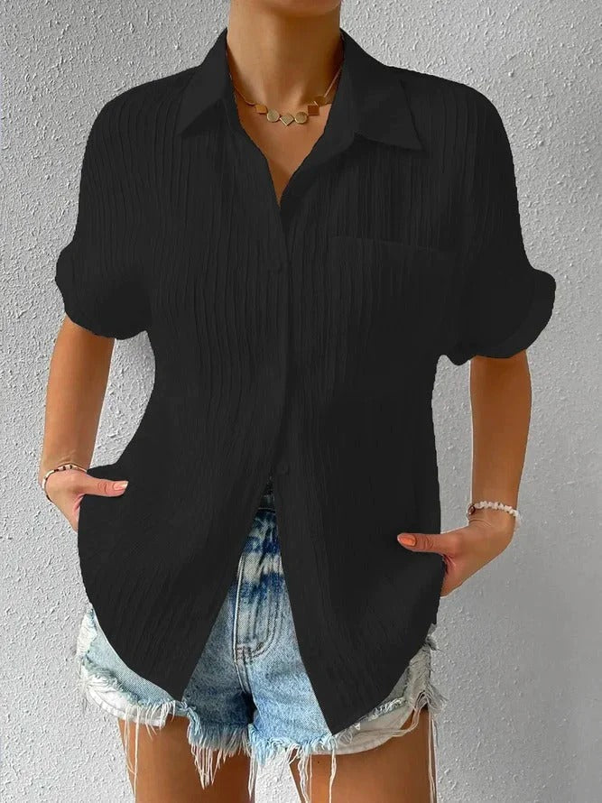 Black women's relaxed fit textured short sleeve button-up shirt, a versatile everyday top.
