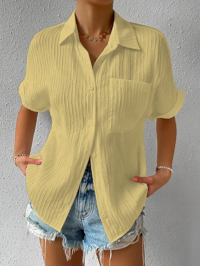 Light blue textured short sleeve blouse for women, a comfortable and casual summer button-up.