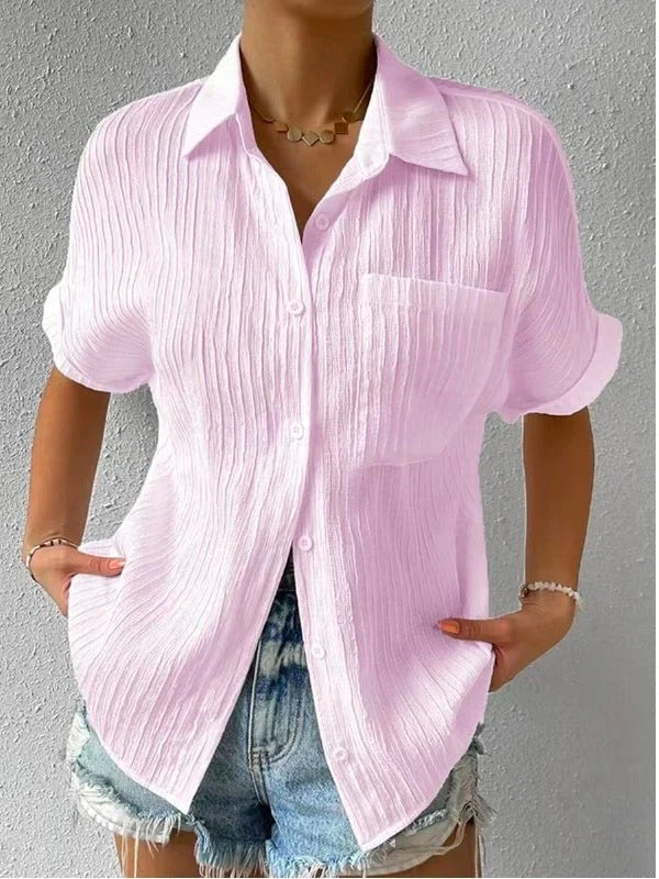 Pink textured short sleeve button-up blouse, a relaxed fit women's shirt perfect for summer.