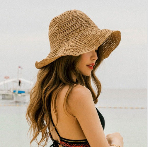 Women's wide brim crochet straw bucket hat for summer beach protection. Breathable and stylish casual headwear.