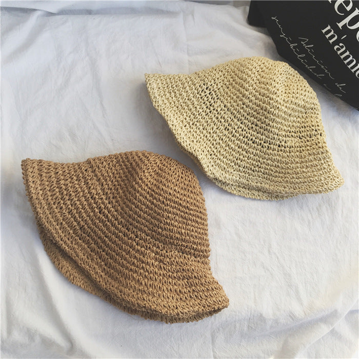 Hand-crocheted women's straw bucket hat with a chic wide brim. Breathable summer hat for beach, travel & casual wear.