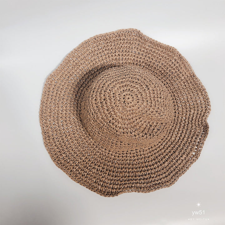 Versatile women's wide brim straw bucket hat. A breathable crochet summer hat for beach, park, or casual outdoor style.