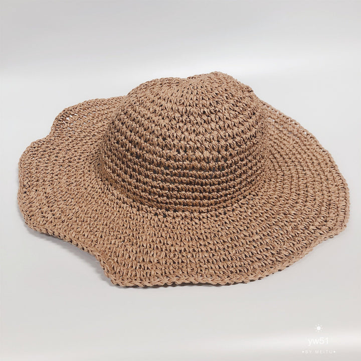 Classic women's wide brim straw bucket hat. Crochet design, perfect for summer beach days and casual sun protection.