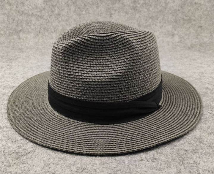 Women's wide brim straw beach hat offering stylish sun protection. Perfect summer accessory for vacation.