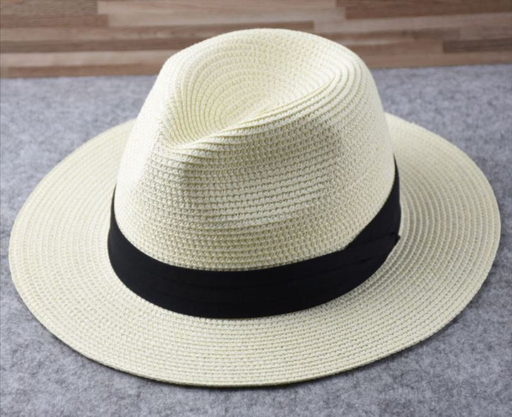 Adjustable wide brim straw hat for women, ideal summer vacation accessory with sun protection.