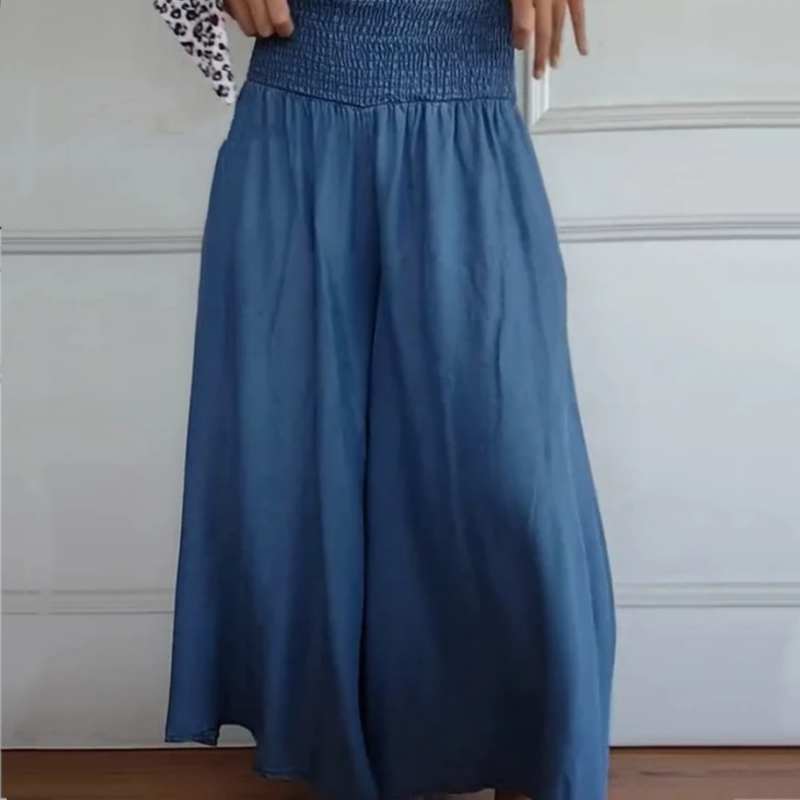 Full-length view of women's comfortable wide-leg high-waist smocked denim pants, ideal for daily wear.
