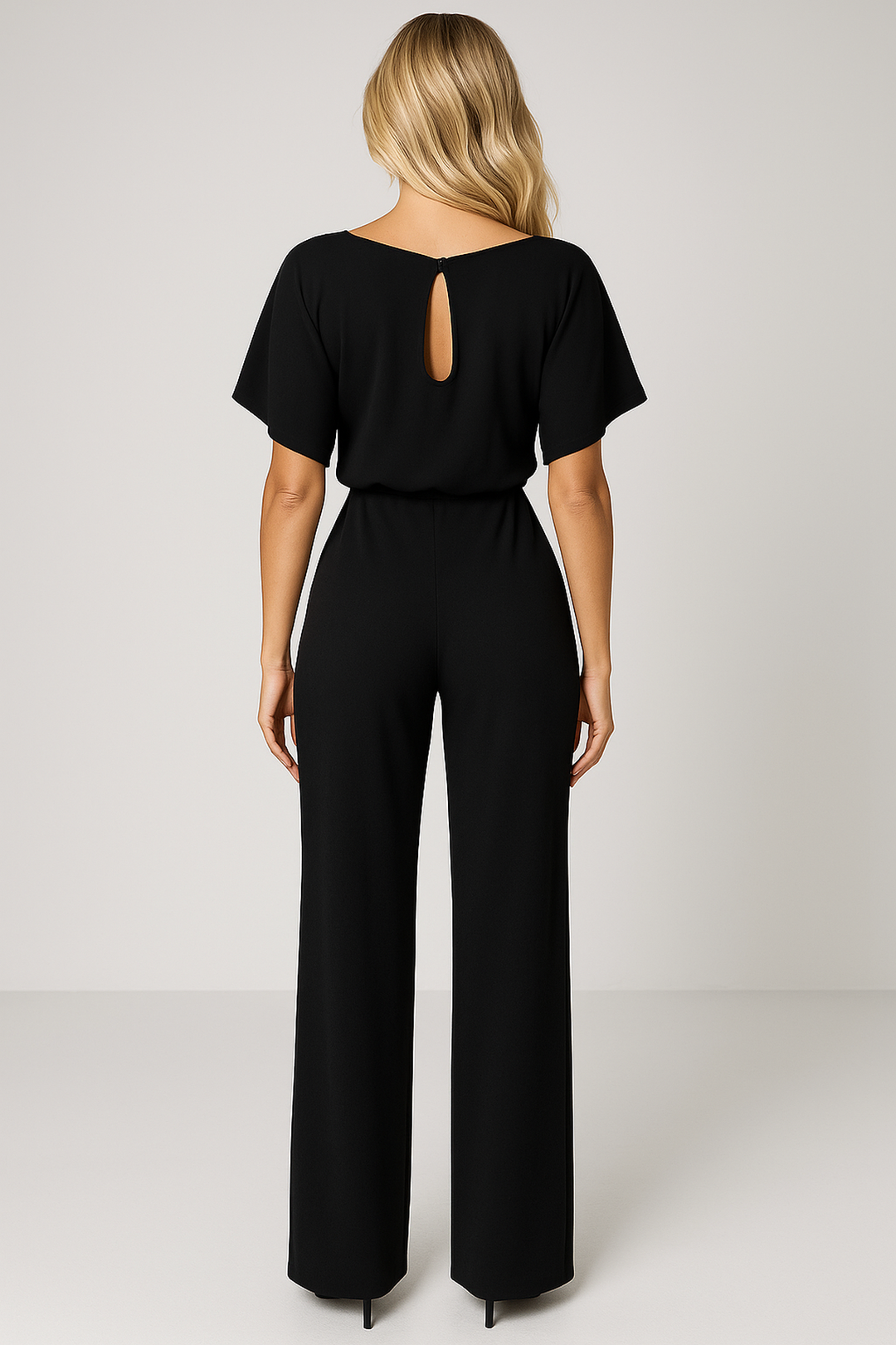 Elegant women's wide leg jumpsuit with a sophisticated boat neck & stylish waist tie detail.