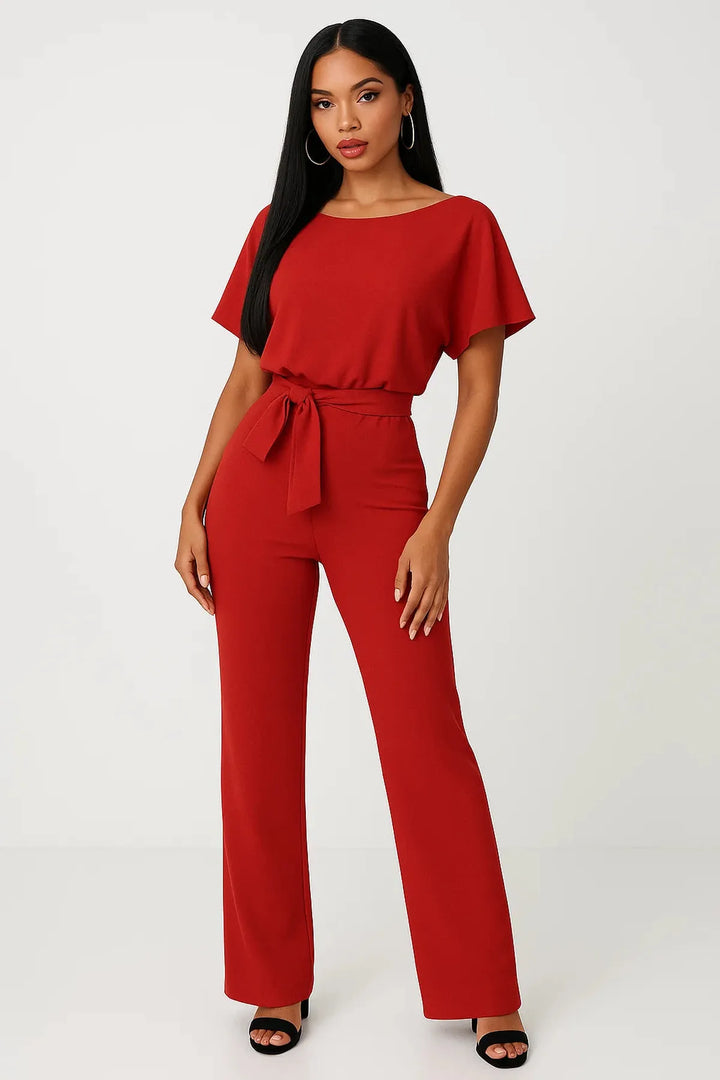 Women's short sleeve wide leg jumpsuit with a boat neck & adjustable waist tie. Comfortable outfit.