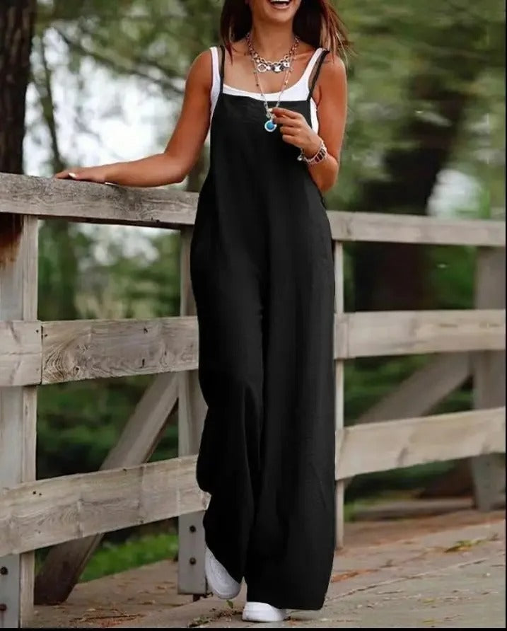 Sleeveless wide leg women's dungaree jumpsuit in a relaxed fit. Effortless style for casual summer outfits.