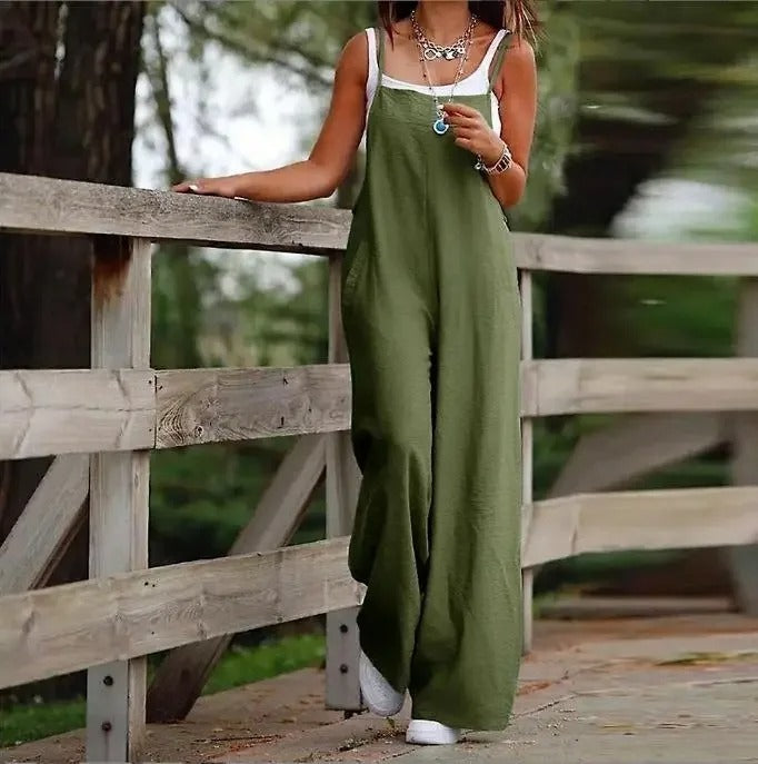 Sleeveless women's wide leg dungaree jumpsuit. Features a relaxed fit, great for comfortable summer outfits.