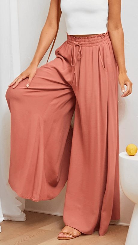 Comfortable & stylish women's wide-leg trousers with elastic waist for all-day wear.