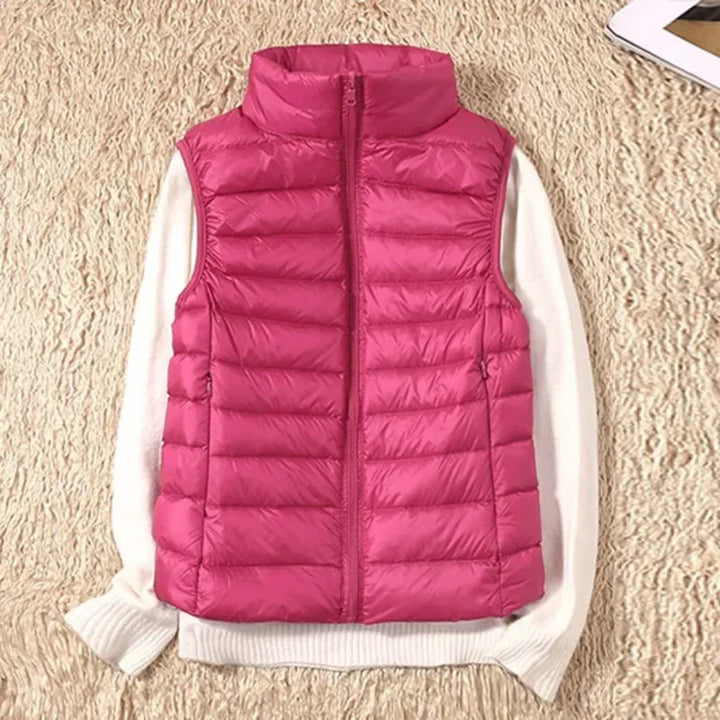 Lightweight wind-resistant women's bodywarmer vest with full zip, ideal for layering.