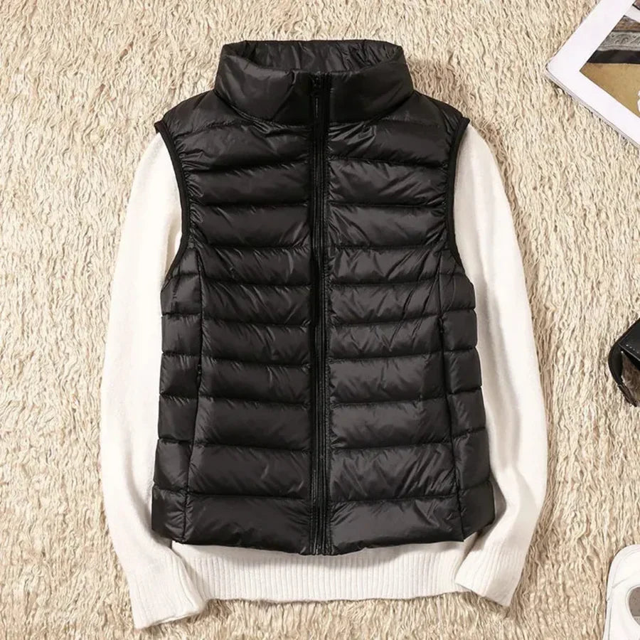 Versatile women's zippered bodywarmer vest, perfect for seamless layering in various seasons.