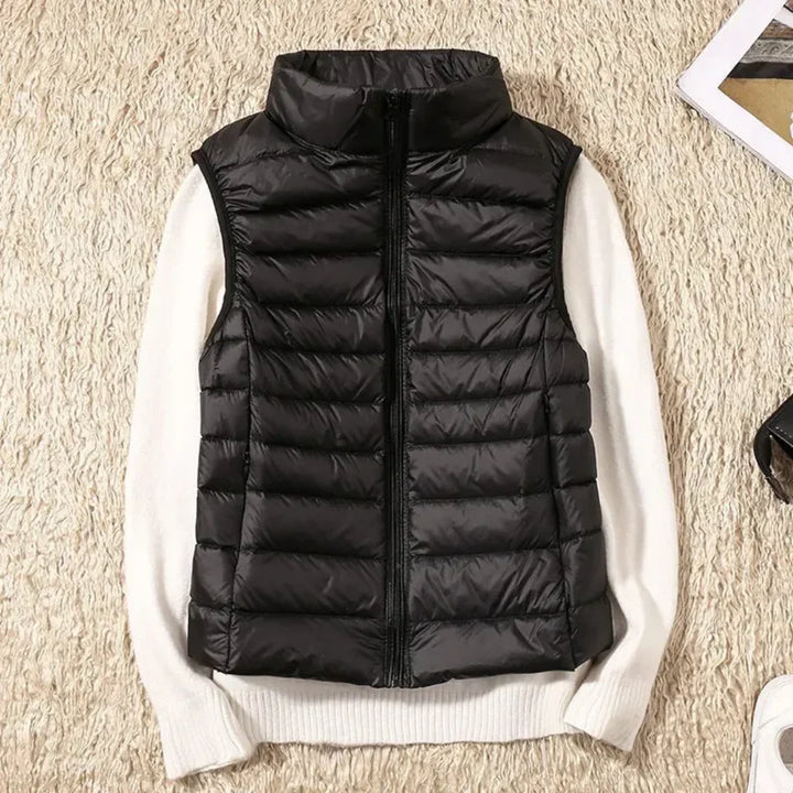 Versatile women's zippered bodywarmer vest, perfect for seamless layering in various seasons.